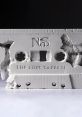 Concrete sculpture of a cassette tape featuring "Nas" and "The Lost Tapes II," highlighting vintage hip-hop culture.