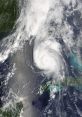 Satellite view of a powerful hurricane forming over the Gulf of Mexico, showcasing distinct cloud patterns and intensity.