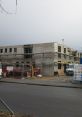 Construction site showcasing scaffolding and building progress, reflecting the development of modern housing for families.