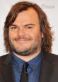 Jack Black smiles confidently in a suit, embodying humor and charisma, perfect for a prank call scenario.