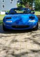 Miata The unmistakable of a revving engine fills the air as a Mazda Miata speeds down the open road. The Miata Song, a