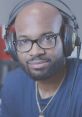 Portrait of Lamar Davis, a musician and GTA character, wearing headphones and glasses, showcasing his artistic vibe.