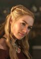 Cersei Lannister smirking with long, wavy hair, wearing a deep red dress and intricate jewelry in a dimly lit setting.