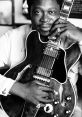 Bb King When you think of BB King, you can't help but hear the sweet of his iconic guitar. The smooth, soulful notes he