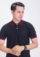 Young man in a stylish black polo shirt with red accents, showcasing modern fashion by Kaos. Effortlessly cool look.