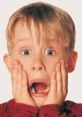 Shocked child with hands on face, reminiscent of Macaulay Culkin's iconic scene in "Home Alone.