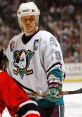 Teemu Selanne, wearing the Anaheim Ducks jersey, focuses intently during a tense playoff game.