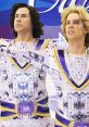 Two flamboyant skaters in futuristic costumes from "Blades of Glory," showcasing their stylish and vibrant outfits on ice.