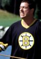 Adam Sandler in a Boston Bruins jersey showcasing a passionate moment from the iconic comedy "Happy Gilmore.