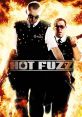 Action-packed scene from "Hot Fuzz" featuring two police officers amidst dramatic flames, showcasing intense comedy and adventure.