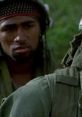 Intense moment from *Platoon*, showcasing soldiers in the Vietnam War, highlighting camaraderie and conflict.