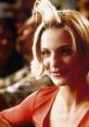 Cameron Diaz as Mary in "There's Something About Mary" showcasing iconic hairstyle and playful expression in a vibrant setting.