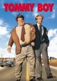 Tommy Boy movie poster featuring Chris Farley and David Spade on a country road, capturing their comedic journey.