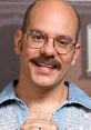 Tobias Fünke smiling with glasses, wearing a denim shirt, a memorable character from Arrested Development.