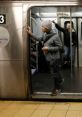 Man exiting NYC Subway train, with fellow passengers visible, capturing the city's vibrant transit atmosphere.