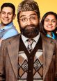 Three characters from "Citizen Khan" smiling together, showcasing British-Pakistani culture and humor in vibrant attire.