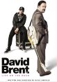 David Brent poses with a guitar alongside a young artist, highlighting the comedic journey in "David Brent: Life on the Road.