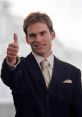 Stifler from American Pie giving a thumbs up, dressed in a stylish suit with a confident smile. Iconic movie moment.