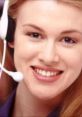 Cheerful telemarketer wearing a headset, representing Jessie the Internet Telemarketer's friendly service and approach.