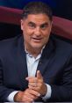 Cenk Uygur gestures while speaking during a discussion, showcasing his passion for political commentary and advocacy.