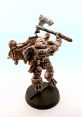 Chaos Space Marines Raptor with a battle axe, showcasing intricate details and dynamic pose for tabletop gaming enthusiasts.