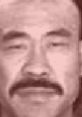 Close-up of a character from "Kung Pow," showcasing a serious expression and distinctive mustache, emphasizing the film's humor.