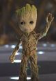 Baby Groot waving cheerfully, showcasing his adorable wooden features and vibrant green sprout on top of his head.