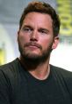 Chris Pratt at a panel, showcasing his thoughtful expression and casual style, representing his charismatic persona.