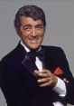 Dean Martin smiles charmingly in a tuxedo, showcasing his iconic style and charisma as a legendary entertainer.