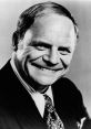 Don Rickles, legendary comedian, smiling in a classic black and white portrait, showcasing his iconic humor and charm.