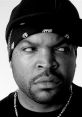 Close-up portrait of Ice Cube showcasing his signature style with a bandana and intense expression, reflecting his iconic persona.