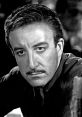 Close-up of Peter Sellers, showcasing his intense expression and classic hairstyle in a monochrome portrait.