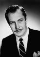 Vincent Price, iconic actor known for his roles in horror films, poses elegantly in a classic black and white photo.