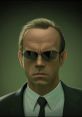 Agent Smith, iconic character from The Matrix, exudes cold intensity with slicked-back hair and dark sunglasses.