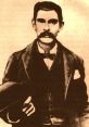 Portrait of Doc Holliday, famed gunslinger and dentist known for his role in the Wild West, wearing a formal suit and hat.