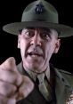 Gunnery Sergeant Hartman furiously berating recruits, showcasing military discipline and authority in iconic film scene.