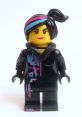 LEGO Lucy Wyldstyle figure with vibrant hair and graffiti-inspired attire, showcasing her unique style and character design.