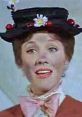 Mary Poppins character smiling, featuring her iconic hat adorned with flowers and a bow, showcasing her whimsical charm.