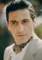 Michael Corleone, wearing a stylish scarf and suit, captures the essence of power and intrigue in classic cinema.