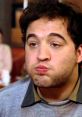 Character from Animal House (1978) making a funny expression, showcasing the film's iconic comedy moments.