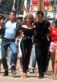 Iconic scene from "Grease" (1978) featuring dance and retro fashion, highlighting the vibrant youth culture of the era.