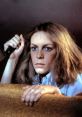 Laurie Strode holding a knife, poised for confrontation in a suspenseful scene from Halloween (1978).