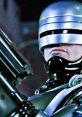 RoboCop stands ready for action, showcasing his iconic helmet and gun in a gritty urban backdrop from the 1987 classic.