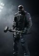 British operator holding a hammer in a tactical outfit, representing resilience in Rainbow Six Siege gameplay.