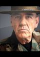 R Lee Ermey in military attire, showcasing his iconic stern expression and leadership presence. Official image of the actor.