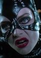 Close-up of Catwoman in "Batman Returns" (1992) showcasing her striking black mask and intense expression.