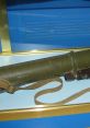 Display of a military RPG with a green casing and strap, highlighting its design and historical significance.