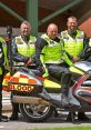 Members of the Blood bike charity in high-visibility gear with motorcycles, promoting blood donation and emergency services.