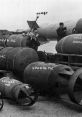 Soldiers prepare various types of bombs, including 1000 lb and 4000 lb, for military operations on a launchpad.