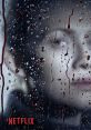 Face partially obscured by rain-splattered glass, conveying themes of suspense and tension in a dramatic narrative. Netflix.